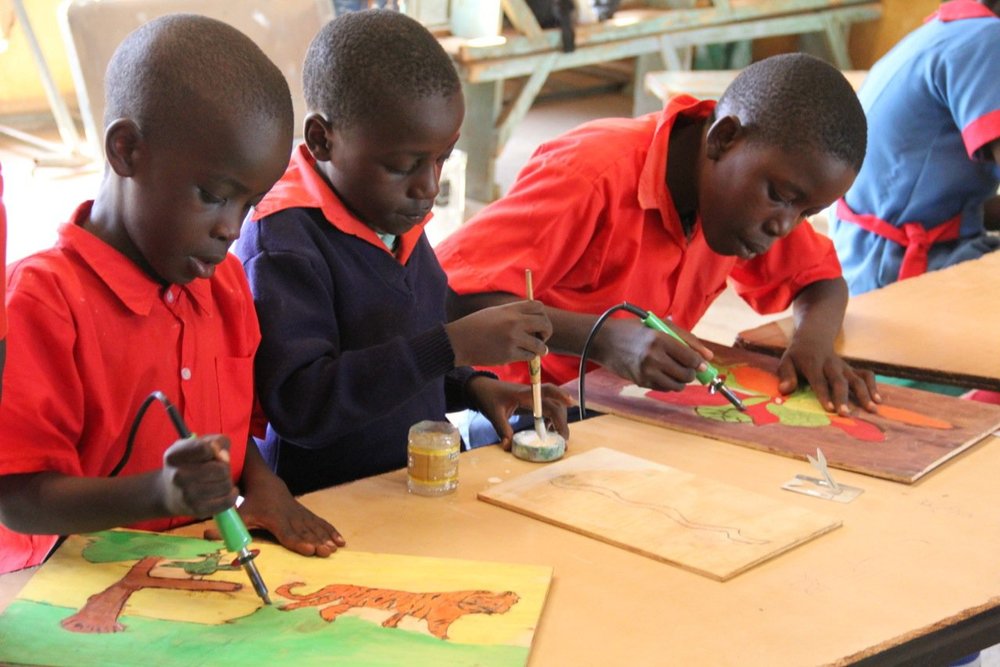 Children painting during a workshop.